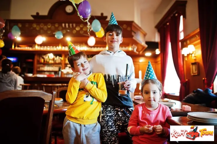 Kids gathered around a table engaging in a hands-on, interactive science experiment.