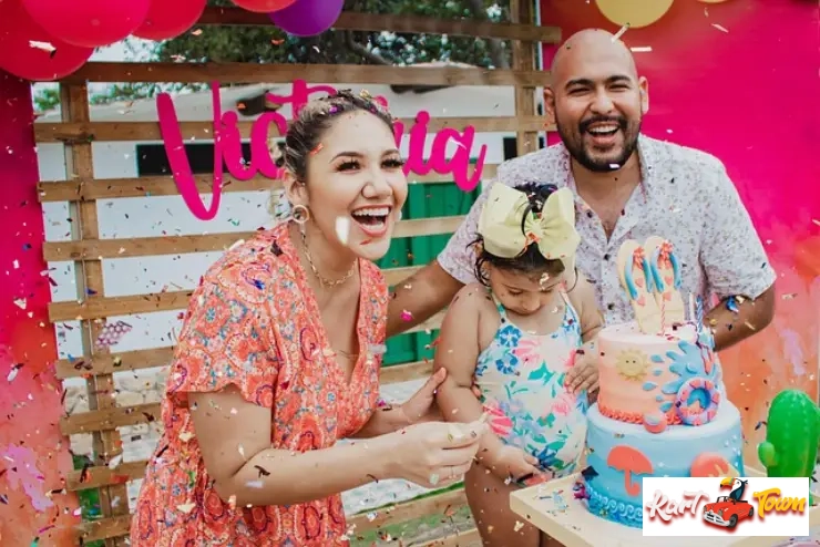 Family celebrating a child's birthday, laughing amidst confetti with a themed cake.