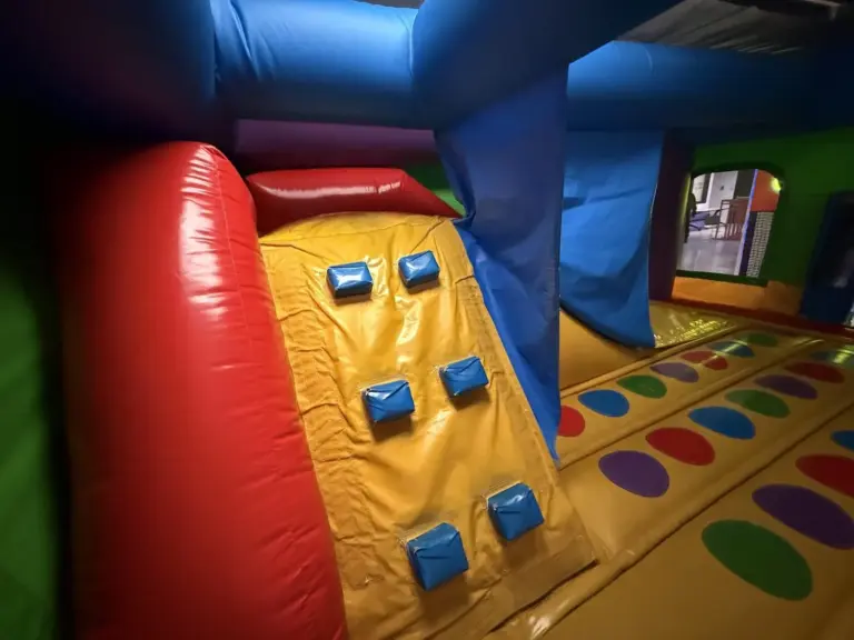 Inflatable bouncy castle with climbing wall and slide at Kart Town