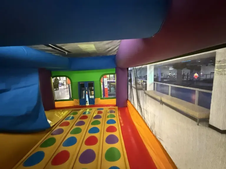 Bouncy castle interior with spotted floor and slide ramp
