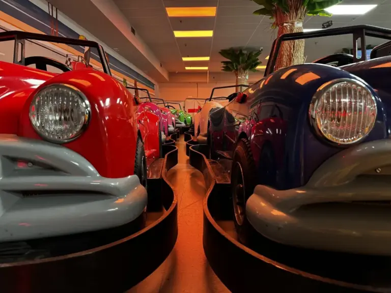 Close-up of two vintage-style classic ride cars