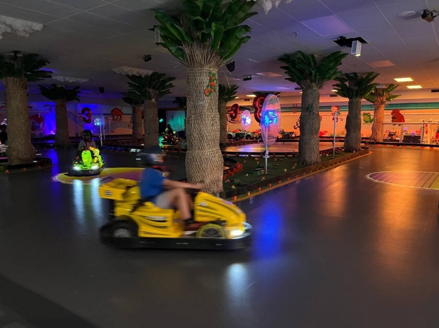 Go-kart speeding around the indoor track
