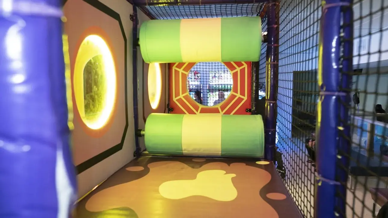 Brightly lit padded play zone for younger kids
