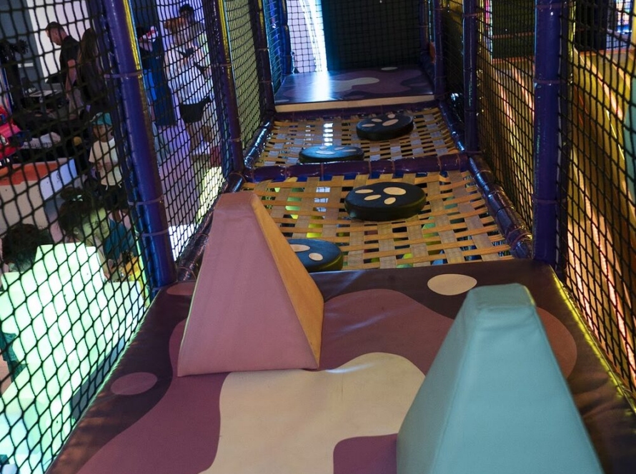 Colorful padded tunnels in the soft play zone