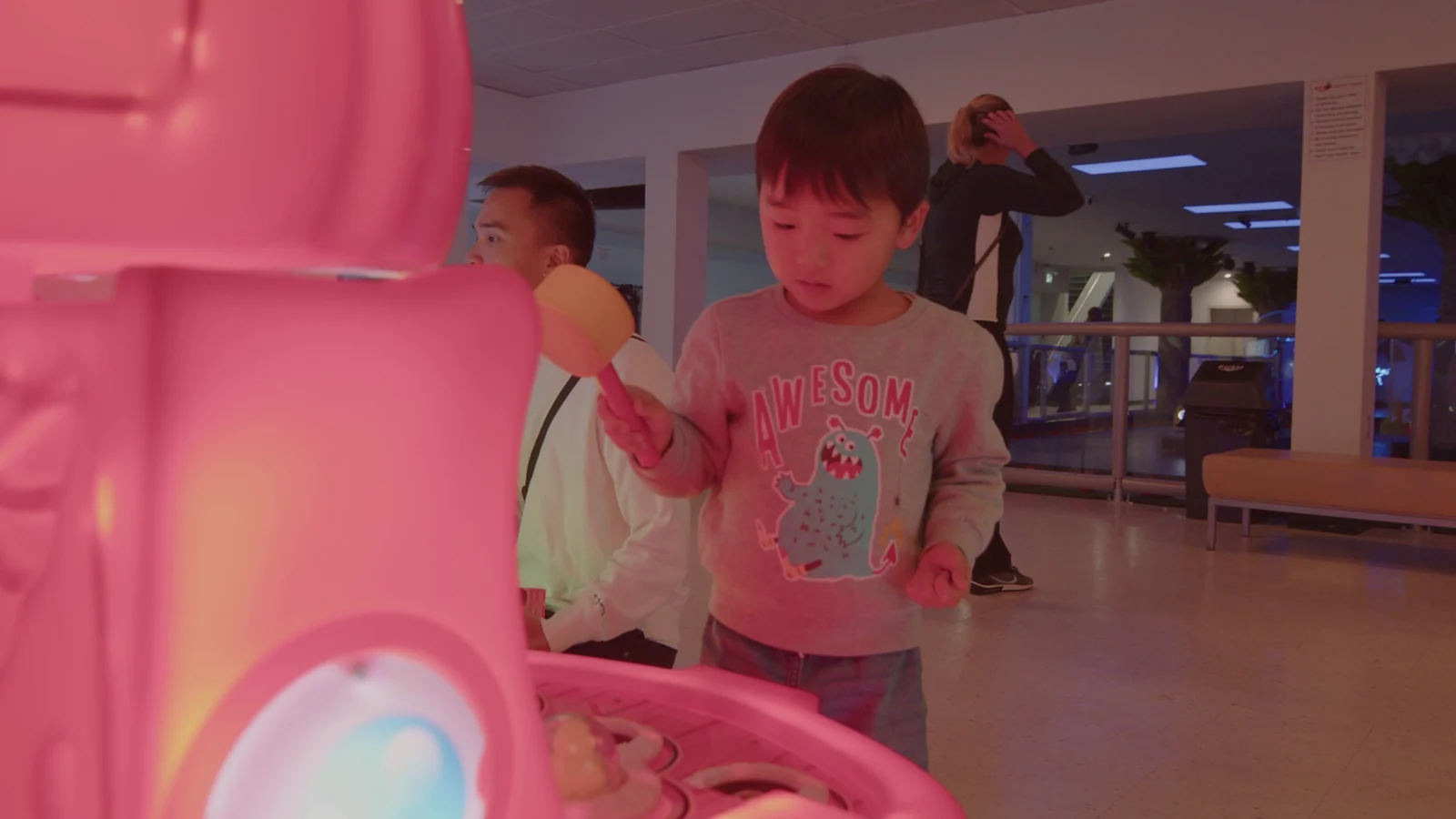 Children playing an arcade game at Kart Town
