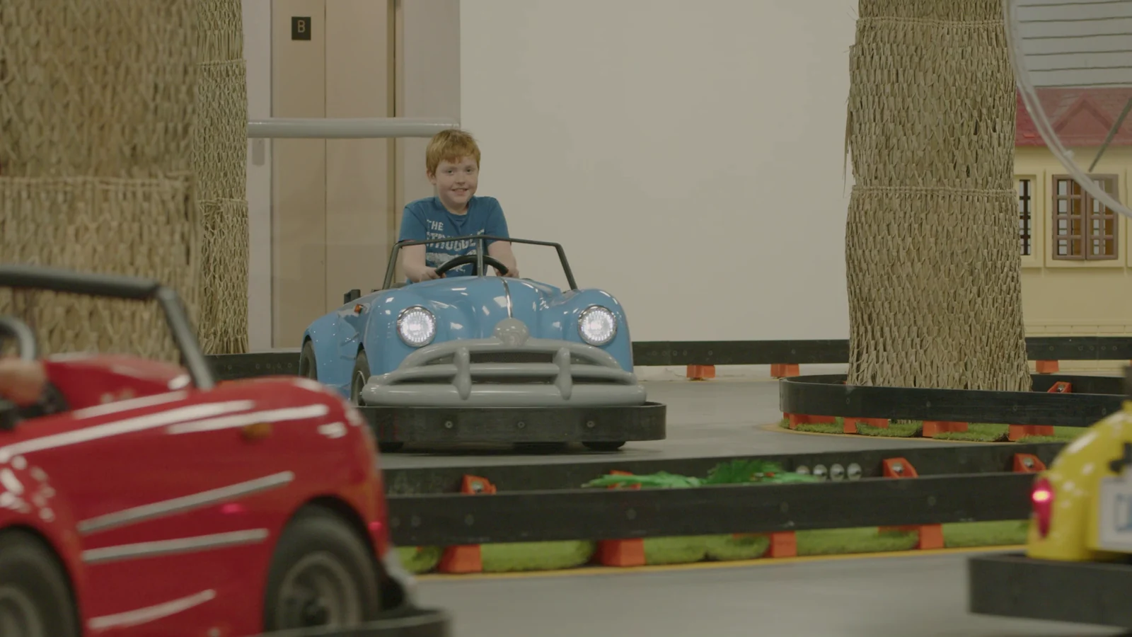 Child driving a blue Classic Kart at Kart Town