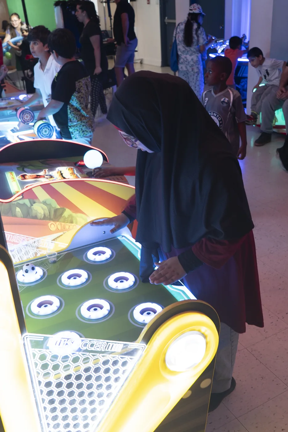 Children enjoying arcade games at Kart Town