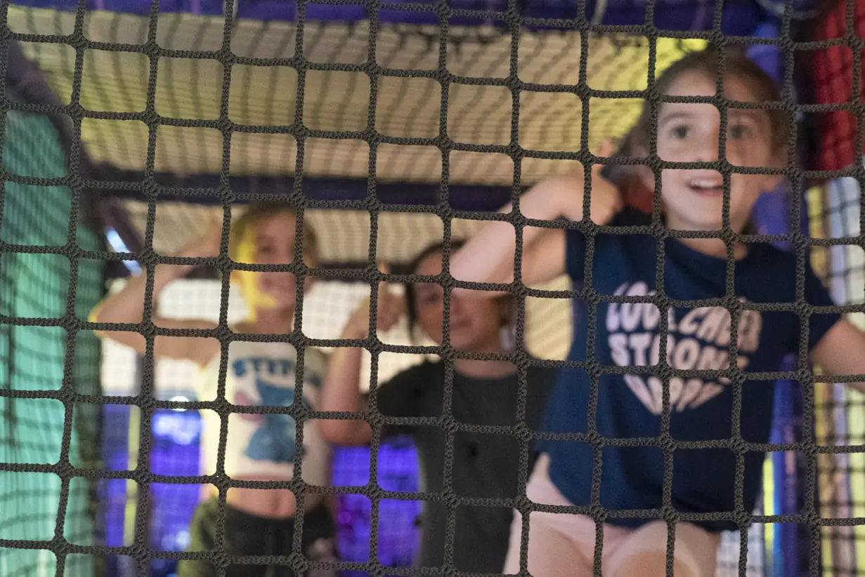 Child in the indoor playground at Kart Town