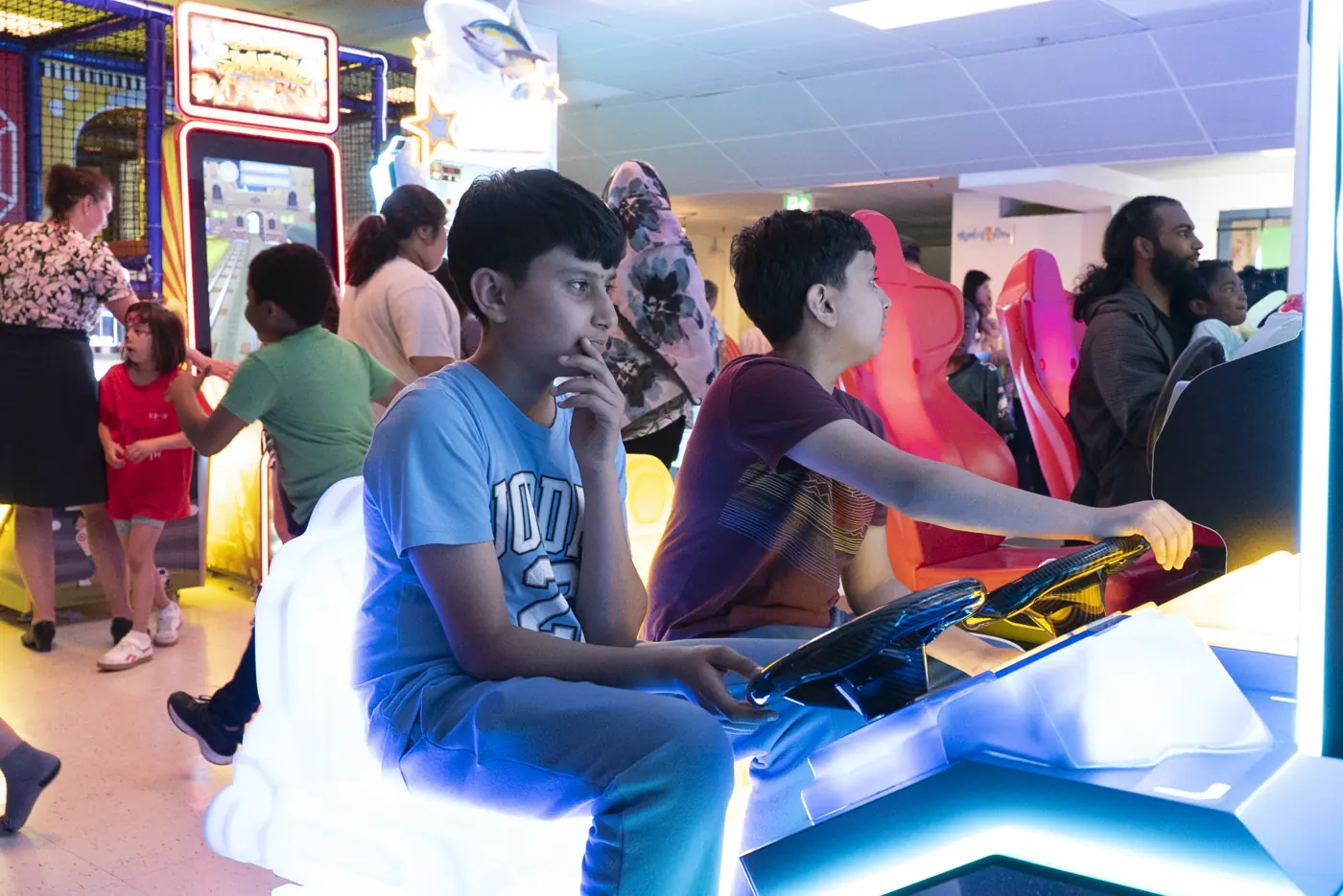 Children enjoying arcade games at Kart Town