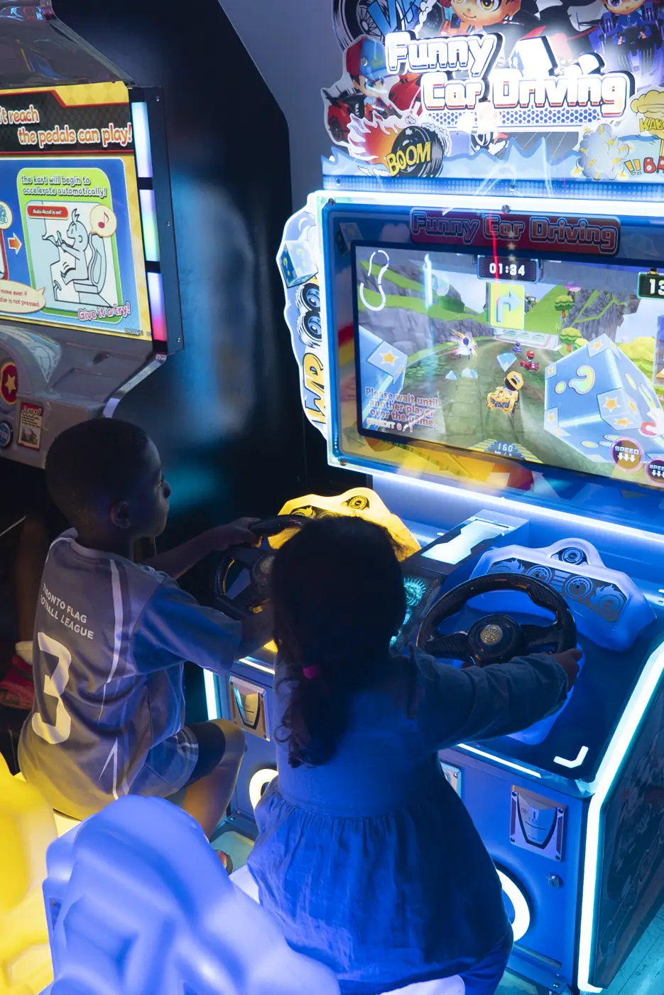 Children enjoying arcade games at Kart Town