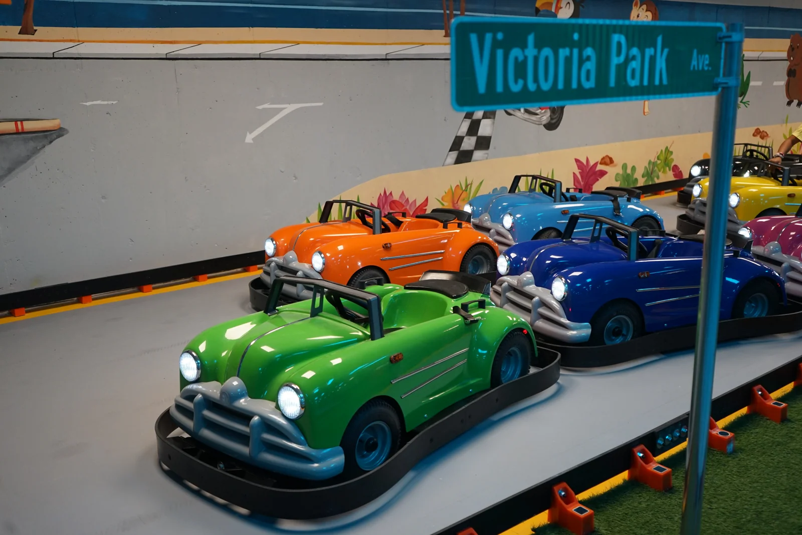 Classic Karts parked beside the mural at Kart Town