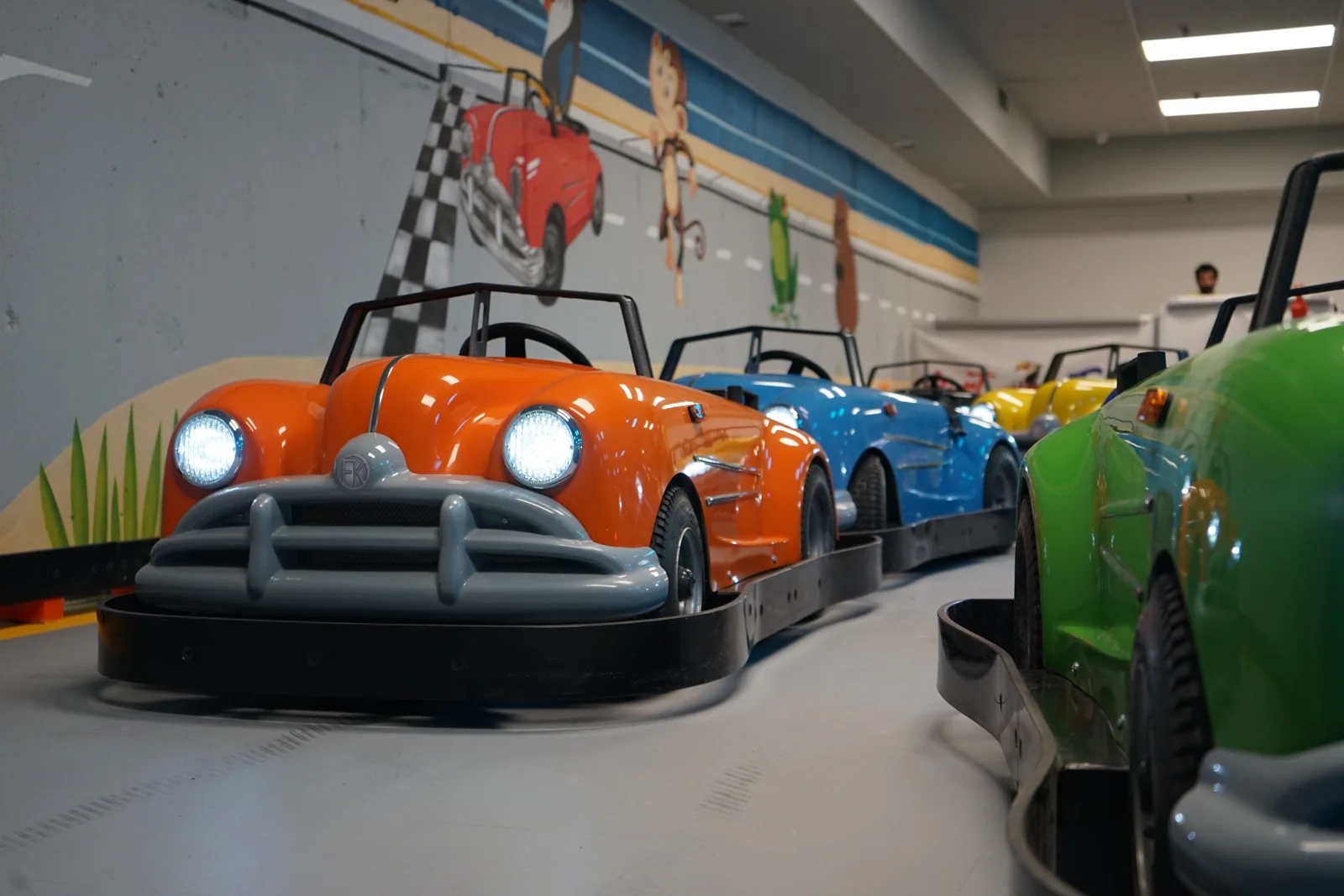 Classic Karts parked beside the mural at Kart Town
