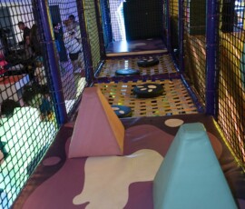 Wind through colourful padded tunnels and obstacles in the soft play zone. Colorful padded tunnels in the soft play zone