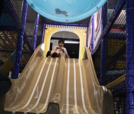 Whoosh down the big slide — one of the most popular spots in the playground. Large slide in the soft play playground