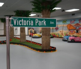 Round the Victoria Park bend on our themed indoor track. Bright wide view of the indoor go-kart track at the Victoria Park sign